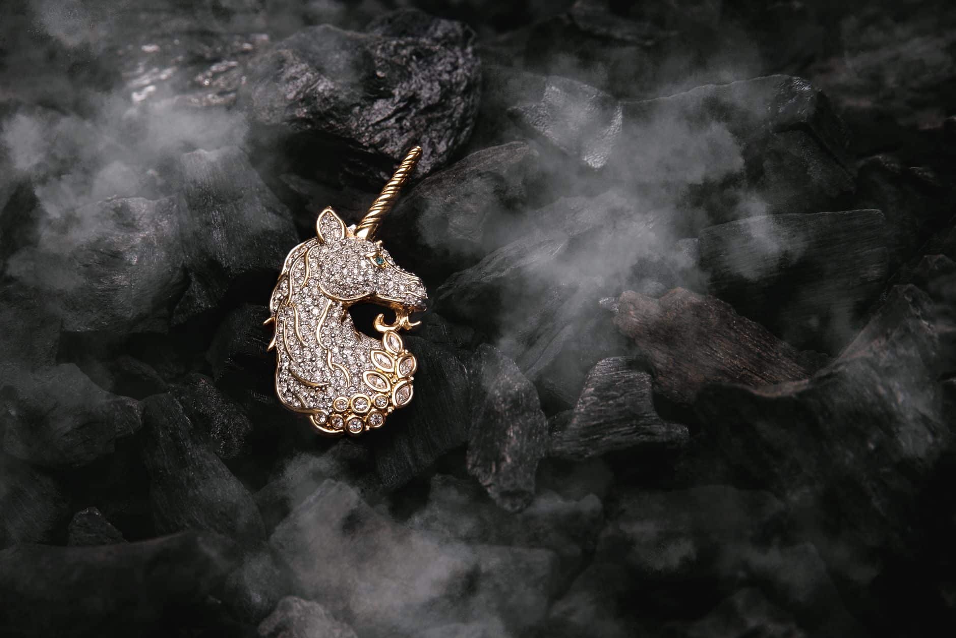 elegant diamond unicorn pendant on dark charcoal